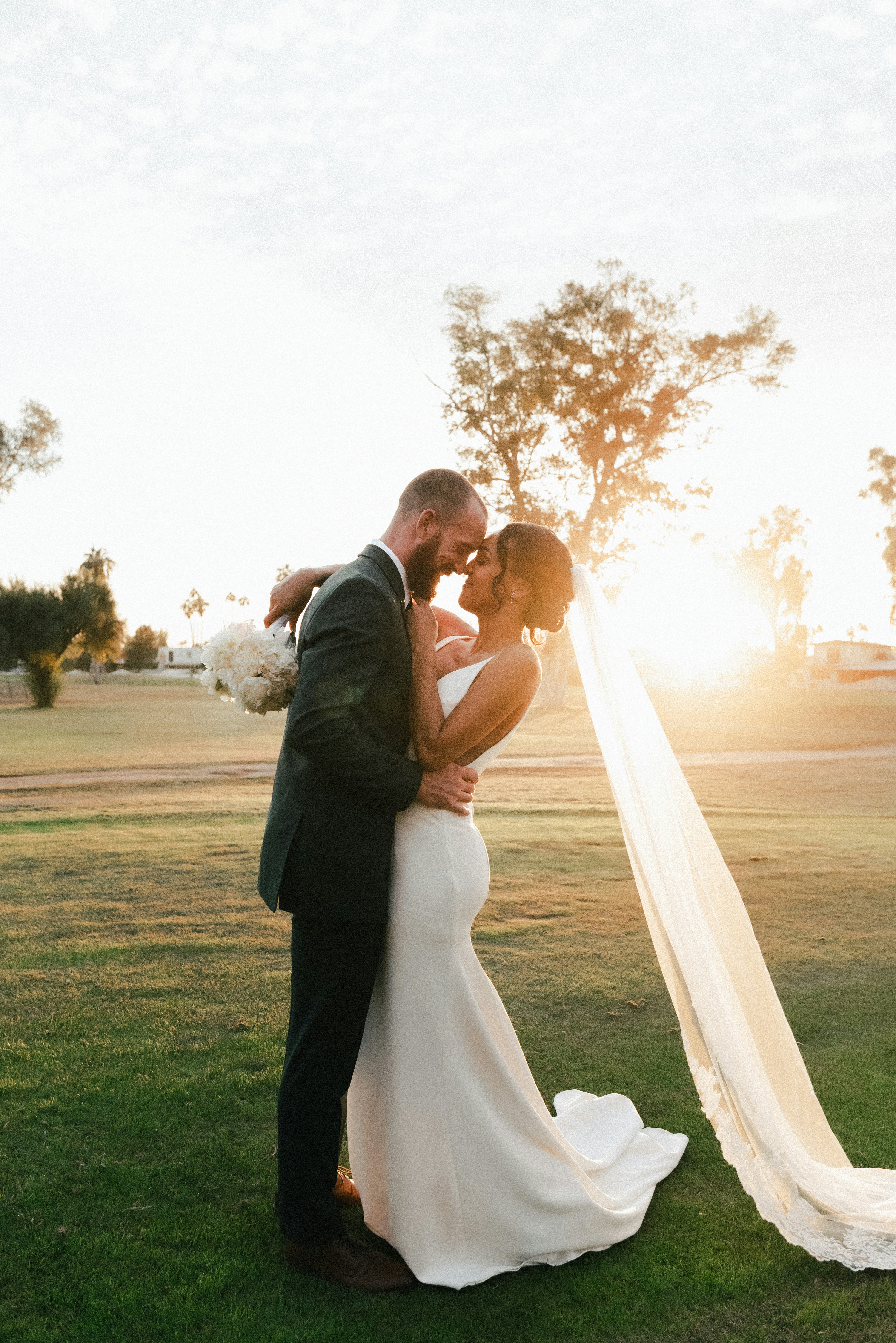 Bride and groom kissing